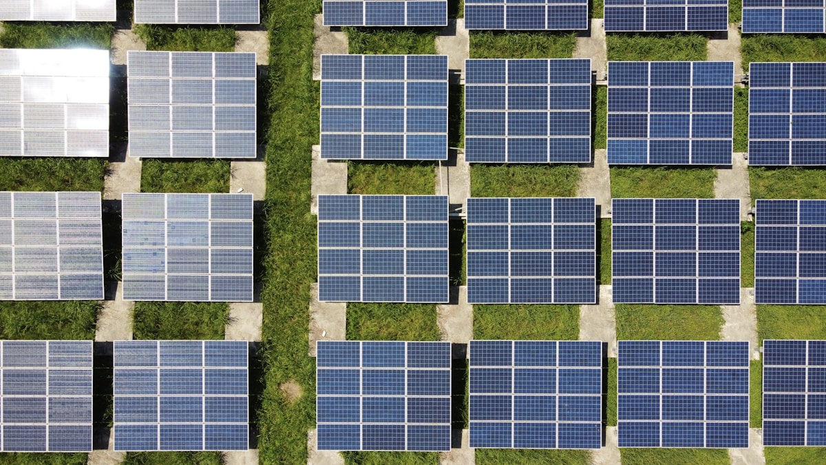 Modern house with premium rooftop solar panels in bright sunlight